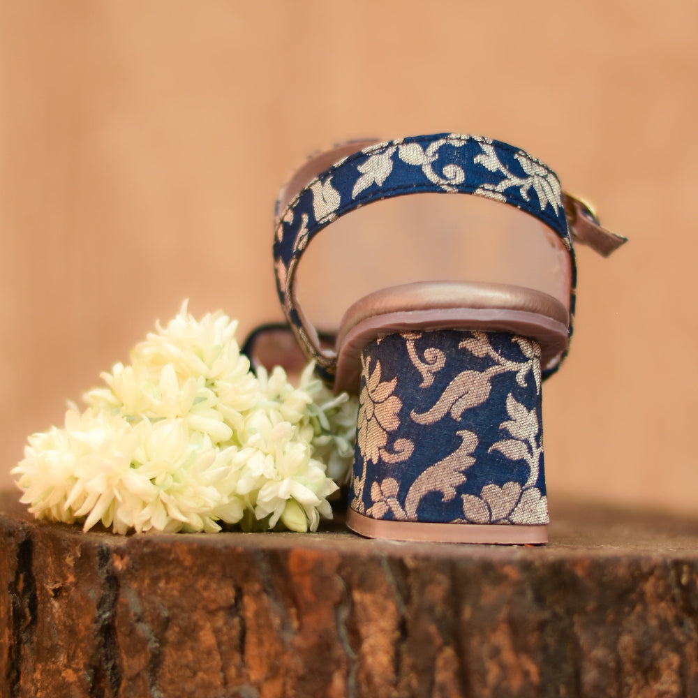 Stable block heel with brocade covering and ankle strap