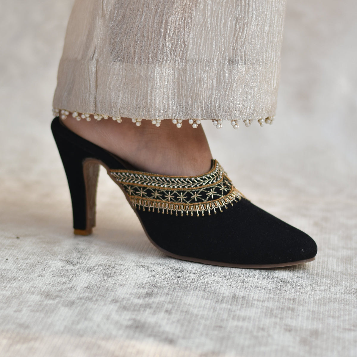 Black suede ethnic mules with glamorous pointed heels for designer outfits