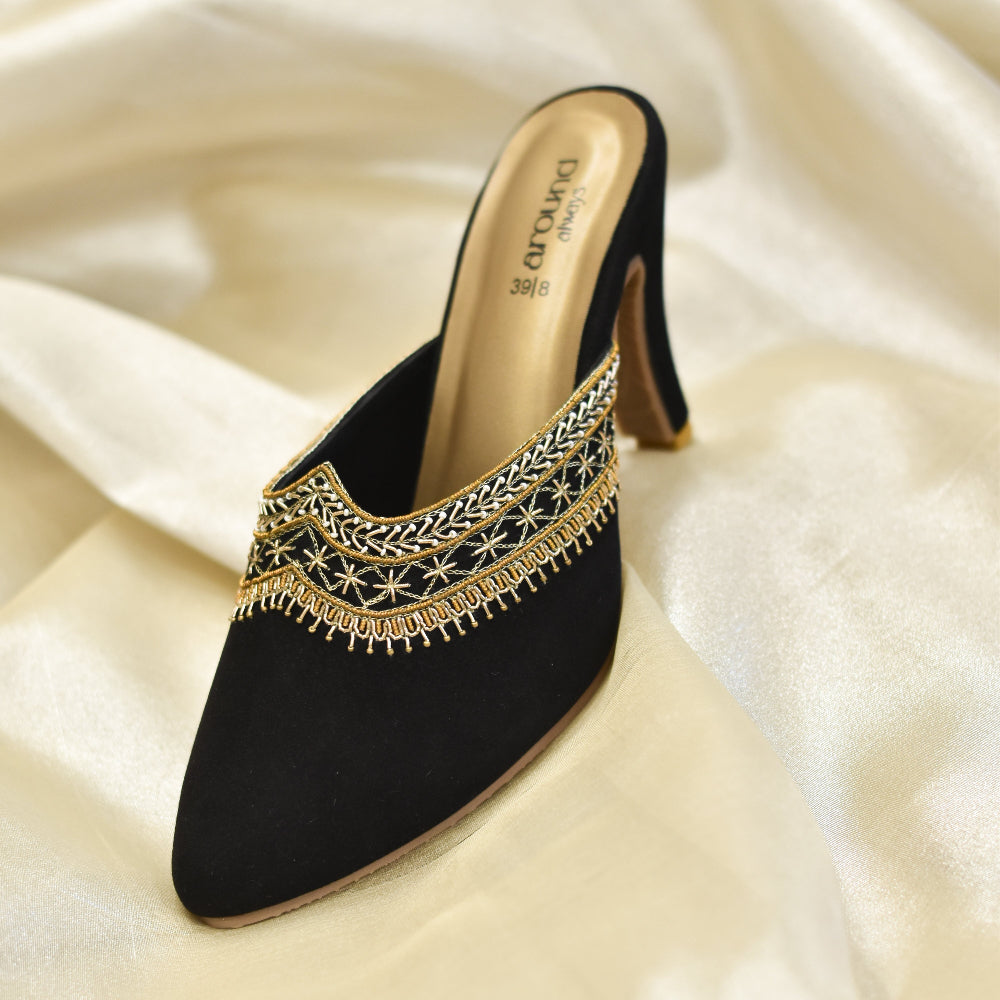 Black slip-on heels for women with metallic embroidery.