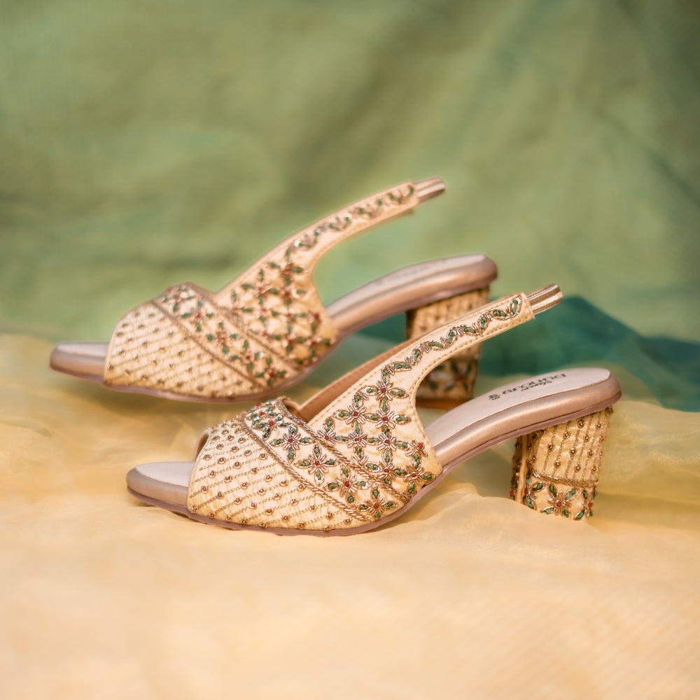 Golden block heels with traditional Indian motifs
