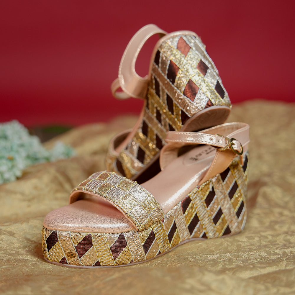 Metallic woven sandal featuring gold, silver and brown textile strips
