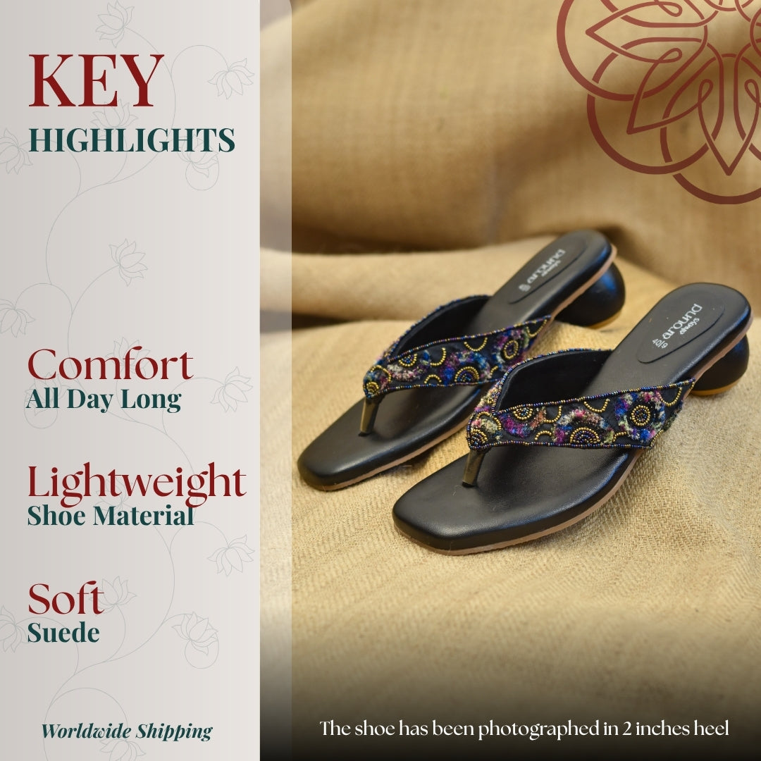 Black embellished toe post sandal with intricate multicolor design 