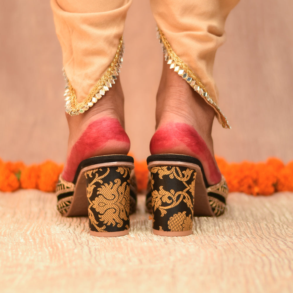 Traditional black and gold embroidered shoes on an anti-slip sole