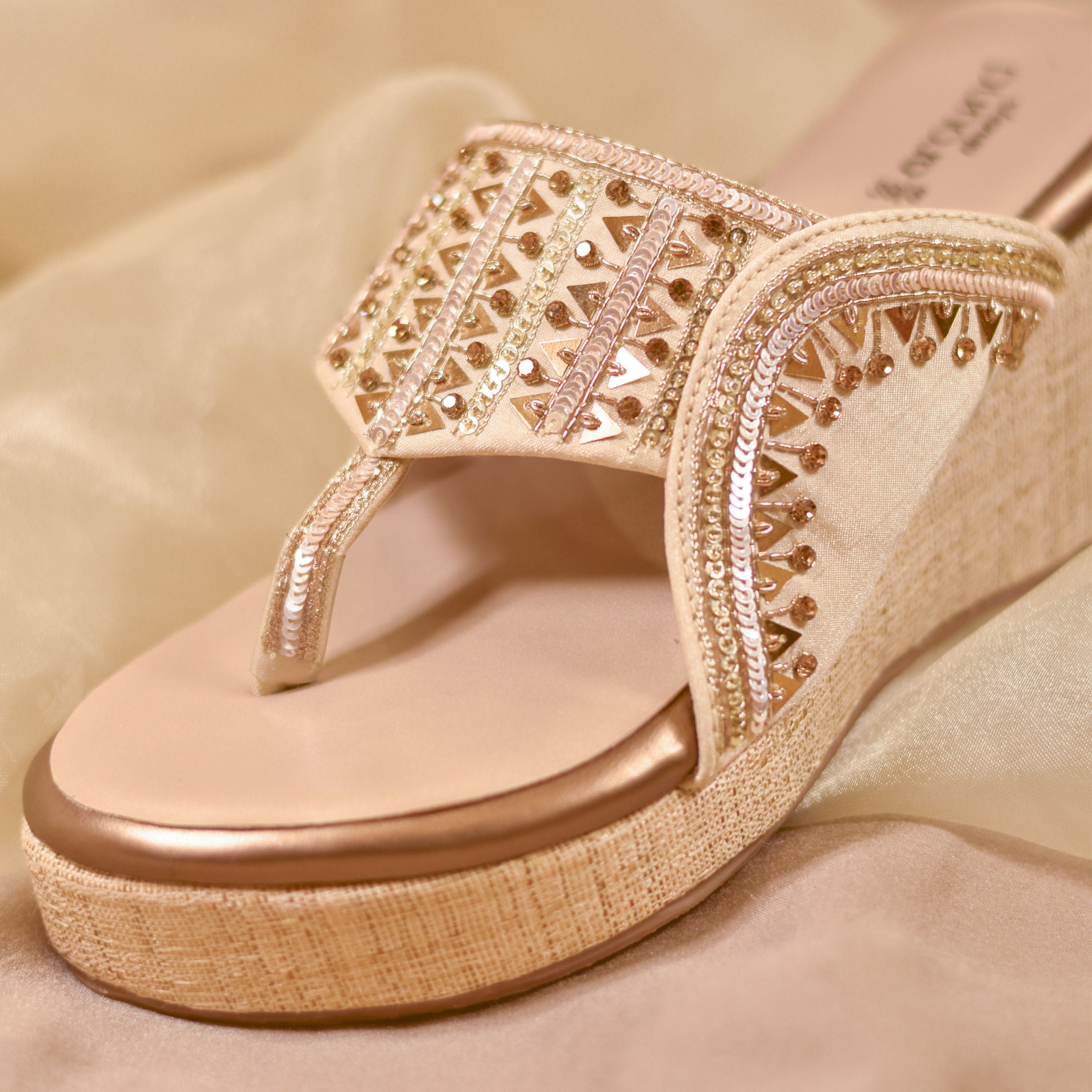 Golden wedge kolhapuri sandals with mirror and bead embellishments
