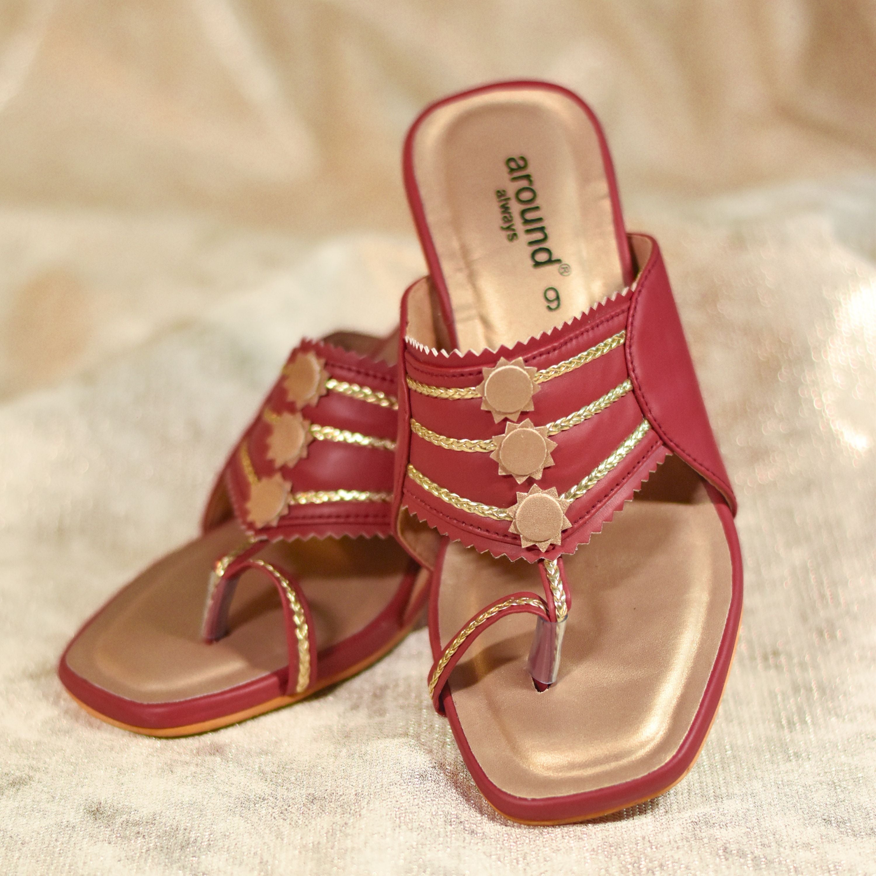 Festive red heels with patterned block heel and gold detailing.