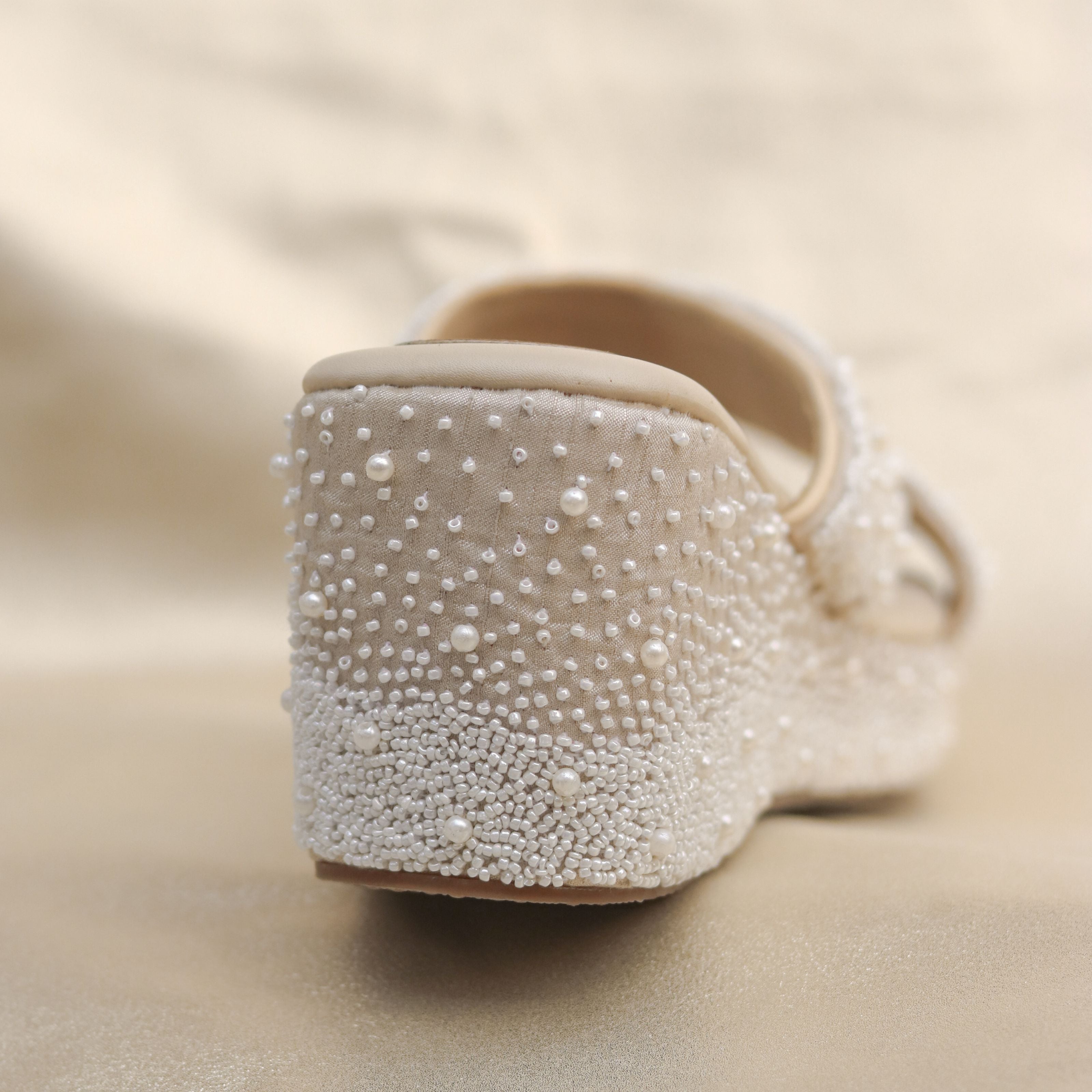 Comfortable beige wedges in high heels with ant-slip insole.