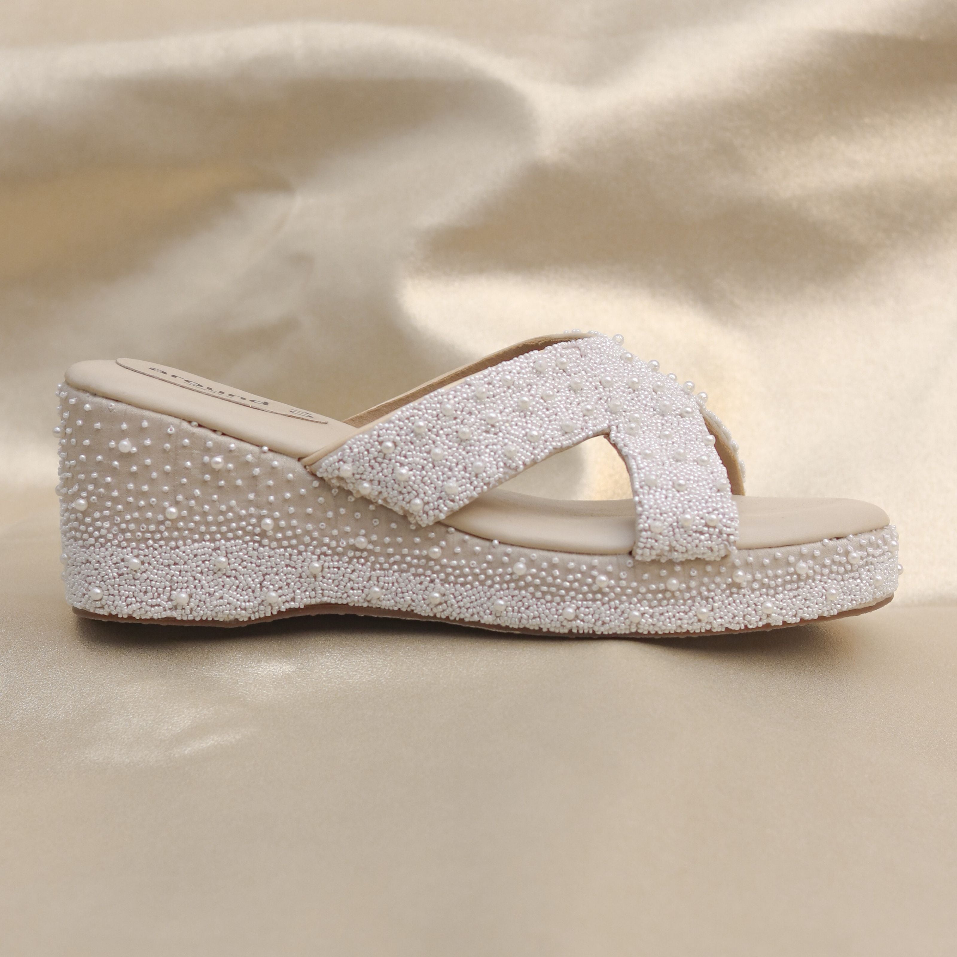 Best beige wedges in cross strap and  hand stitched bead embroidery.