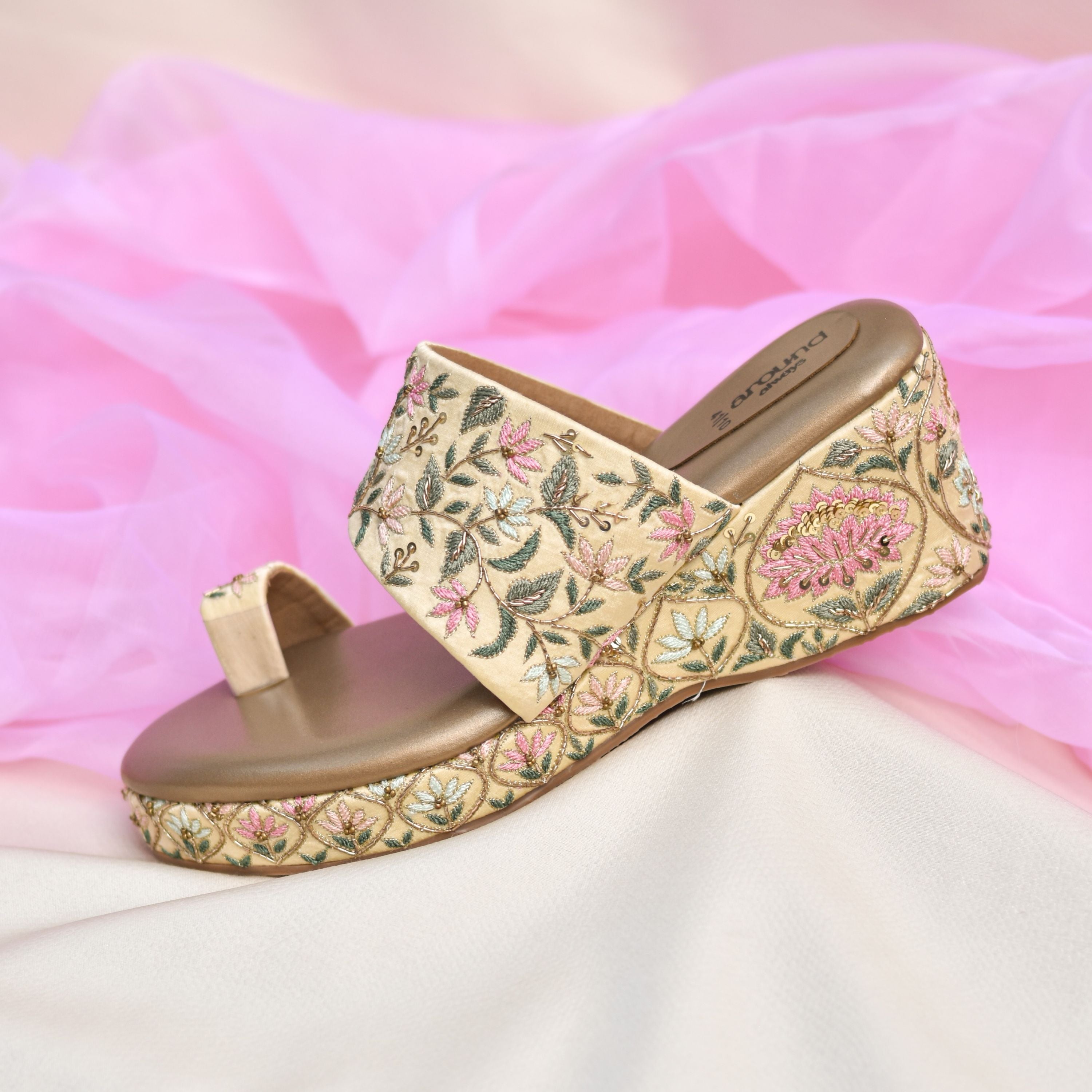 Floral embroidered wedge heels in gold with toe ring design.