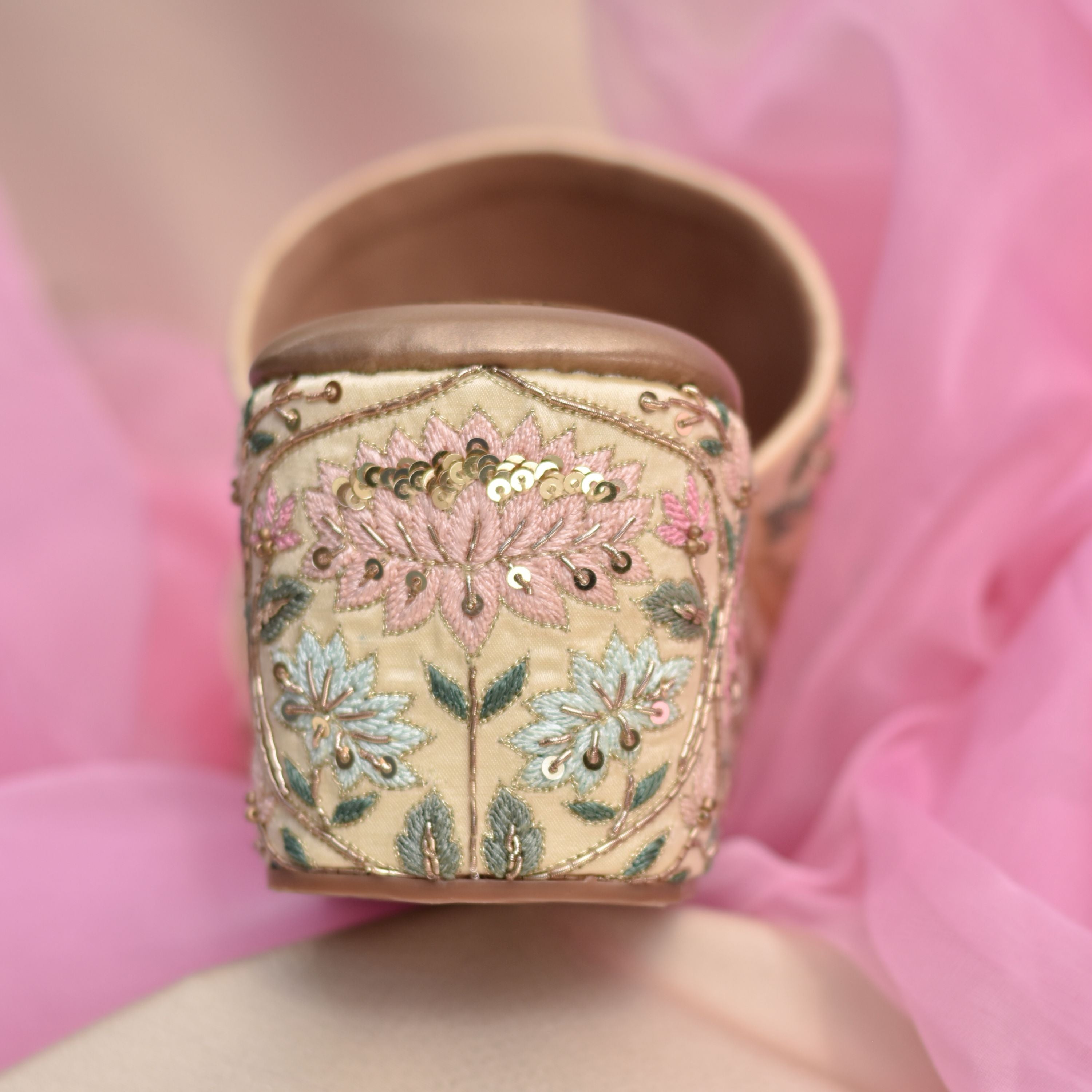 Pastel floral pattern wedges for women, handcrafted with detailed stitching.