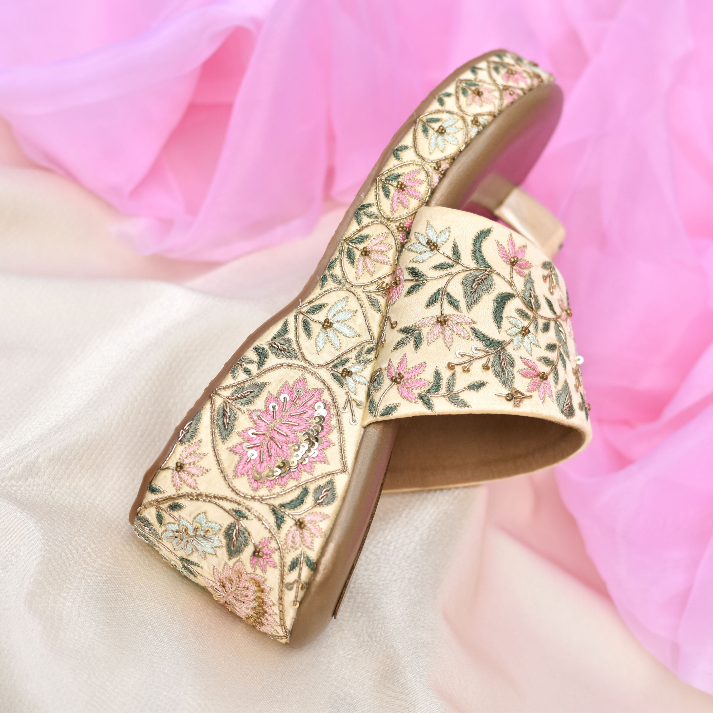 Indian festive wedge sandals with cushioned sole and embroidered strap.