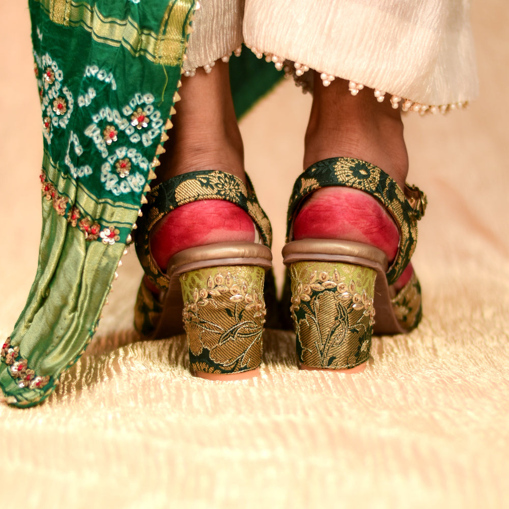 Festive open-toe heel with ankle strap and traditional woven pattern in green