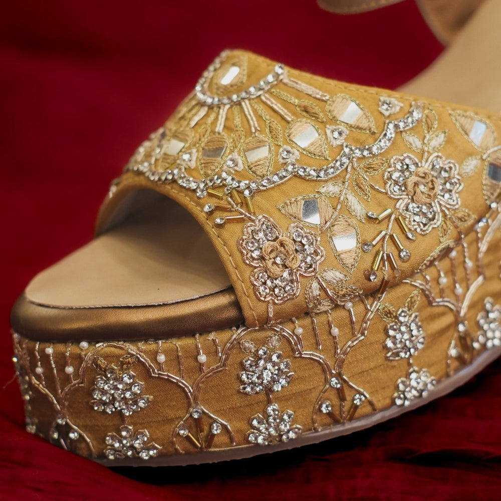 Festive gold sandal with adjustable ankle strap
