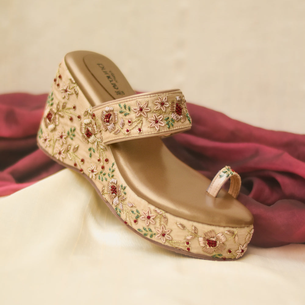 Women's Gold embroidered wedge sandals for festive occasions.
