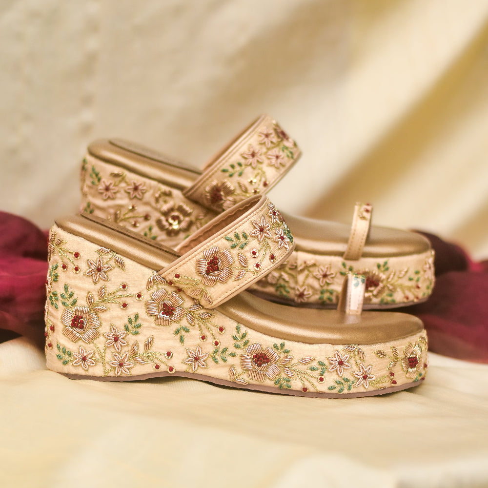 Bridal Gold platform wedges with floral embellishments.
