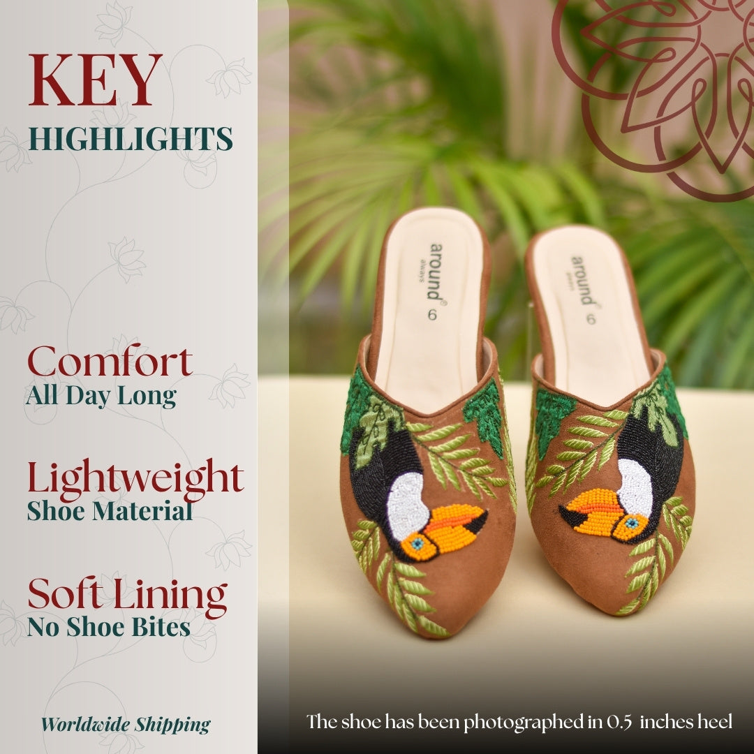 Artistic toucan embroidered slip ons with botanical design and comfortable fit