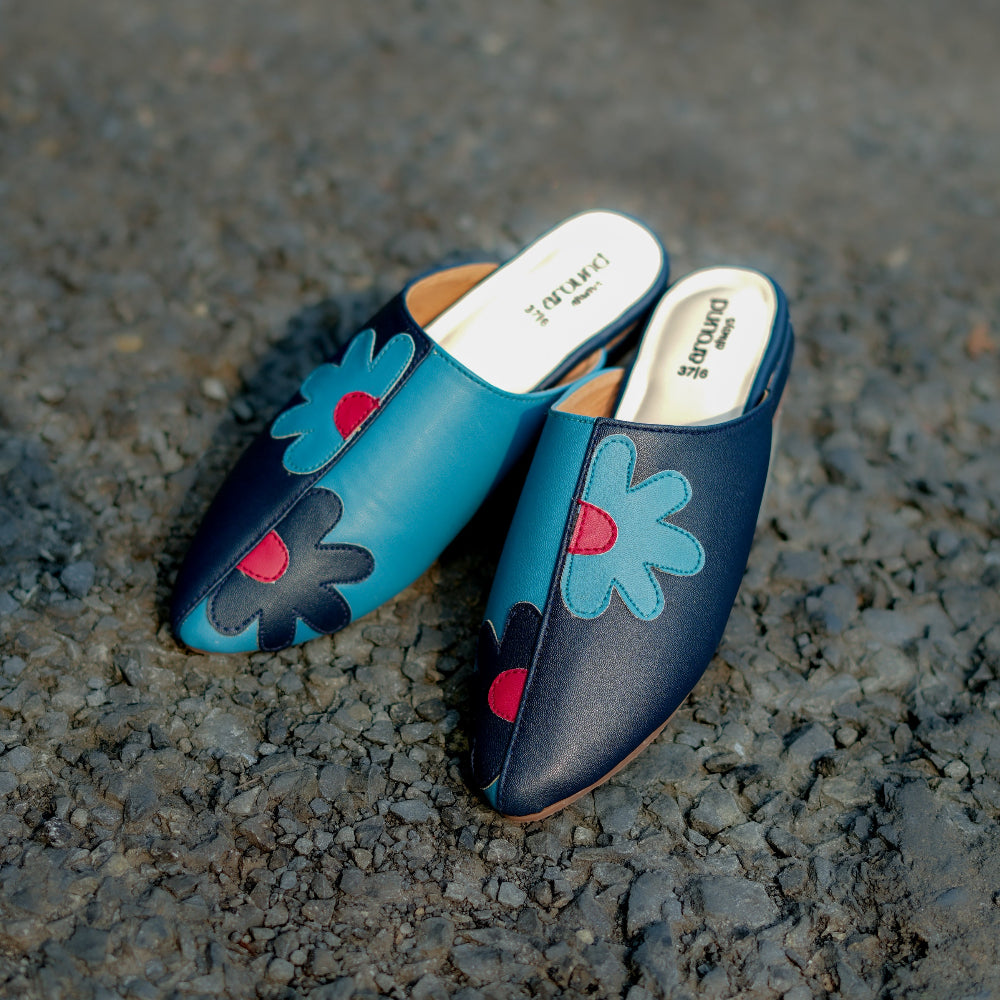 Dark blue flat mule featuring blue and pink flower motifs
