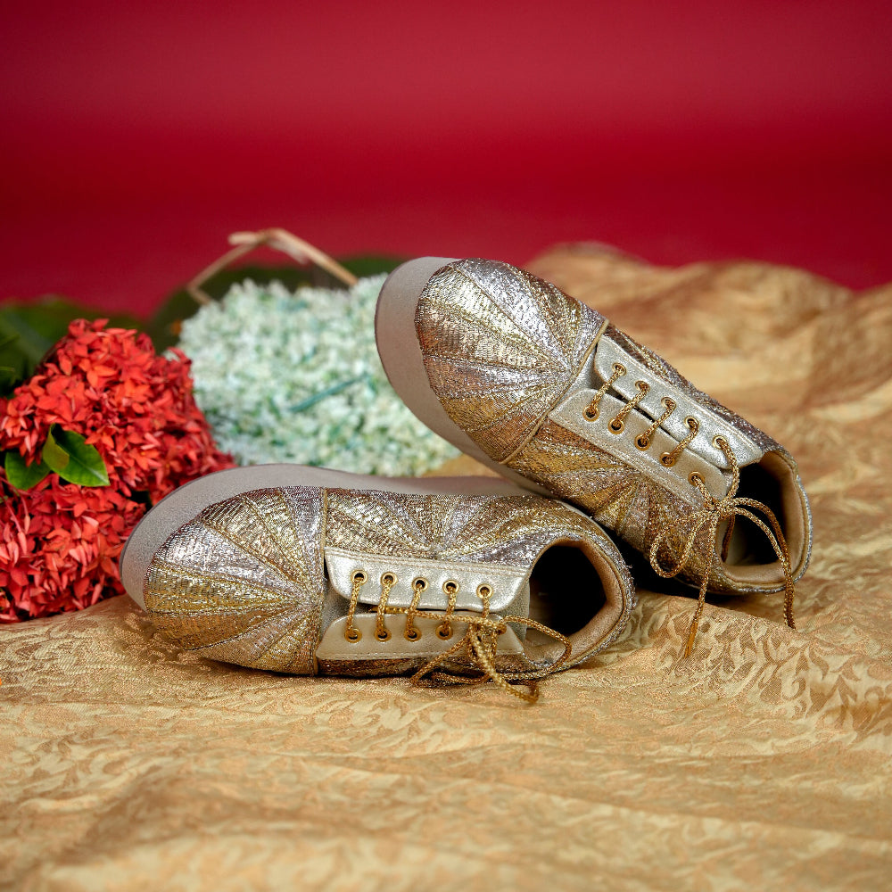 Champagne high wedge sneaker featuring radiating textile panels
