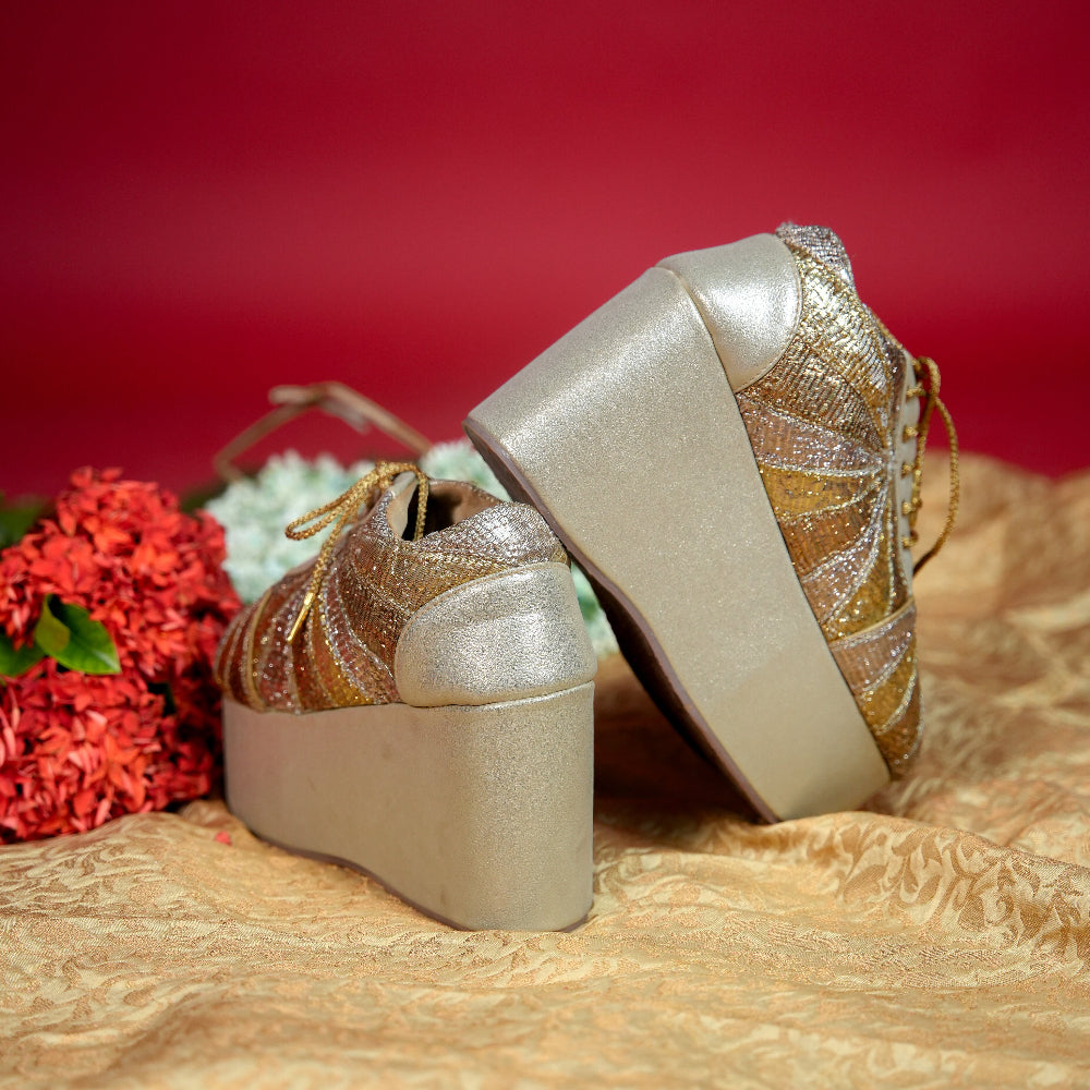 Metallic gold and silver wedding sneaker with elevated wedge sole
