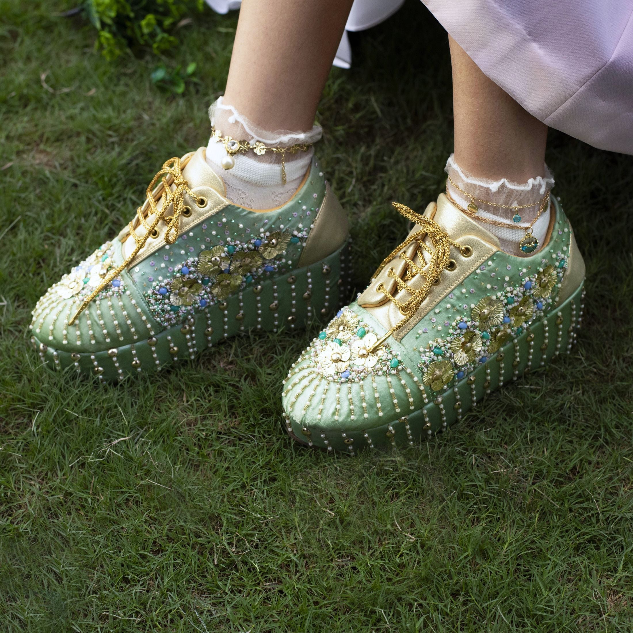 Sea green platform sneakers with floral design and metallic beads and sequins