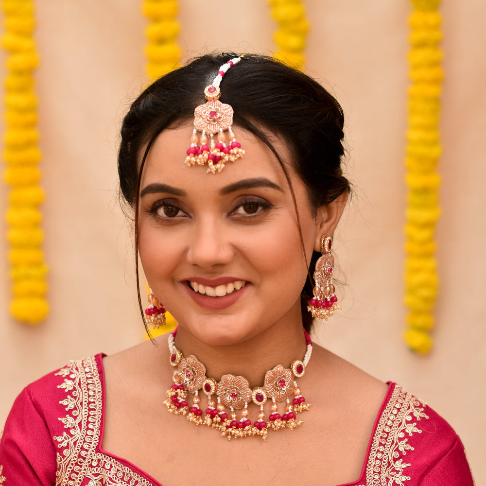 Woman wearing trendy beaded jewellery in pink colour tones