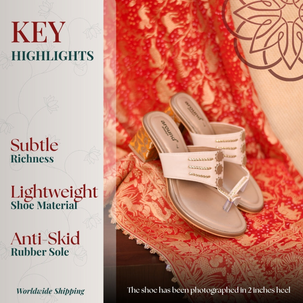 Minimal festive ivory block heel with gold highlights and textured design 