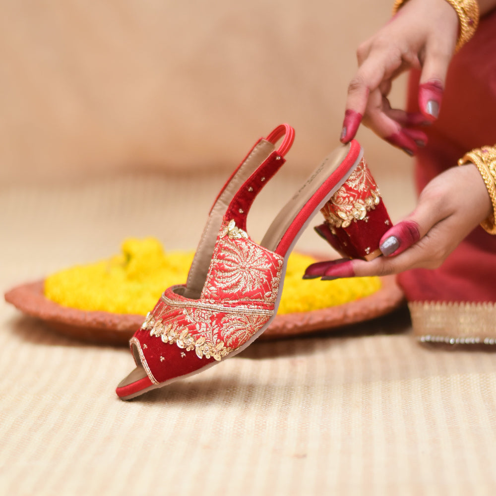 Red open-toe heel with gold woven pattern and slingback strap