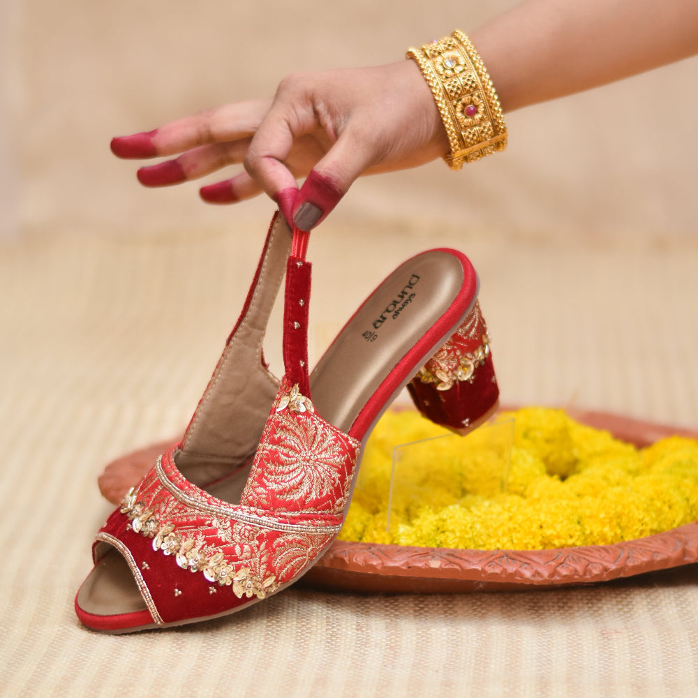 Traditional inspired red sandal with detailed surface design