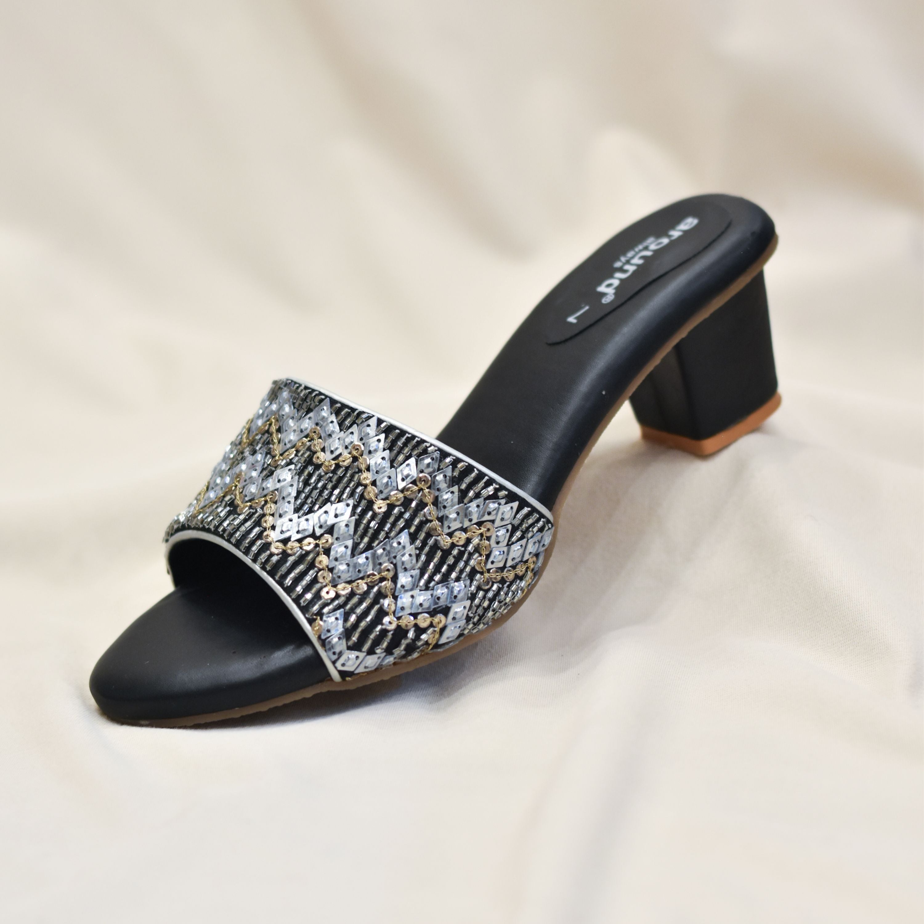 Black sandal with sequin embellishments and cushioned insole