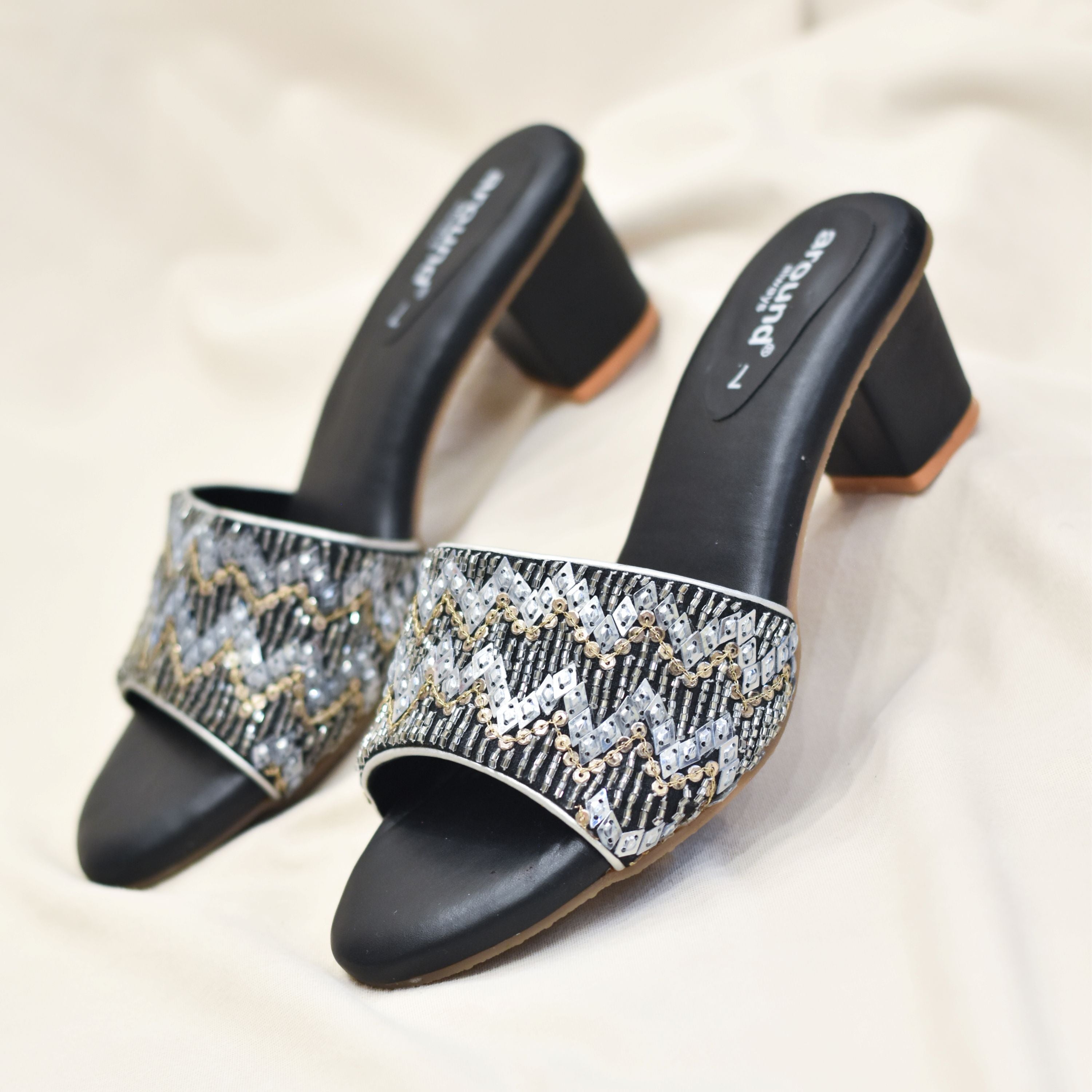 Black block heels with gold and silver chevron sequin design.