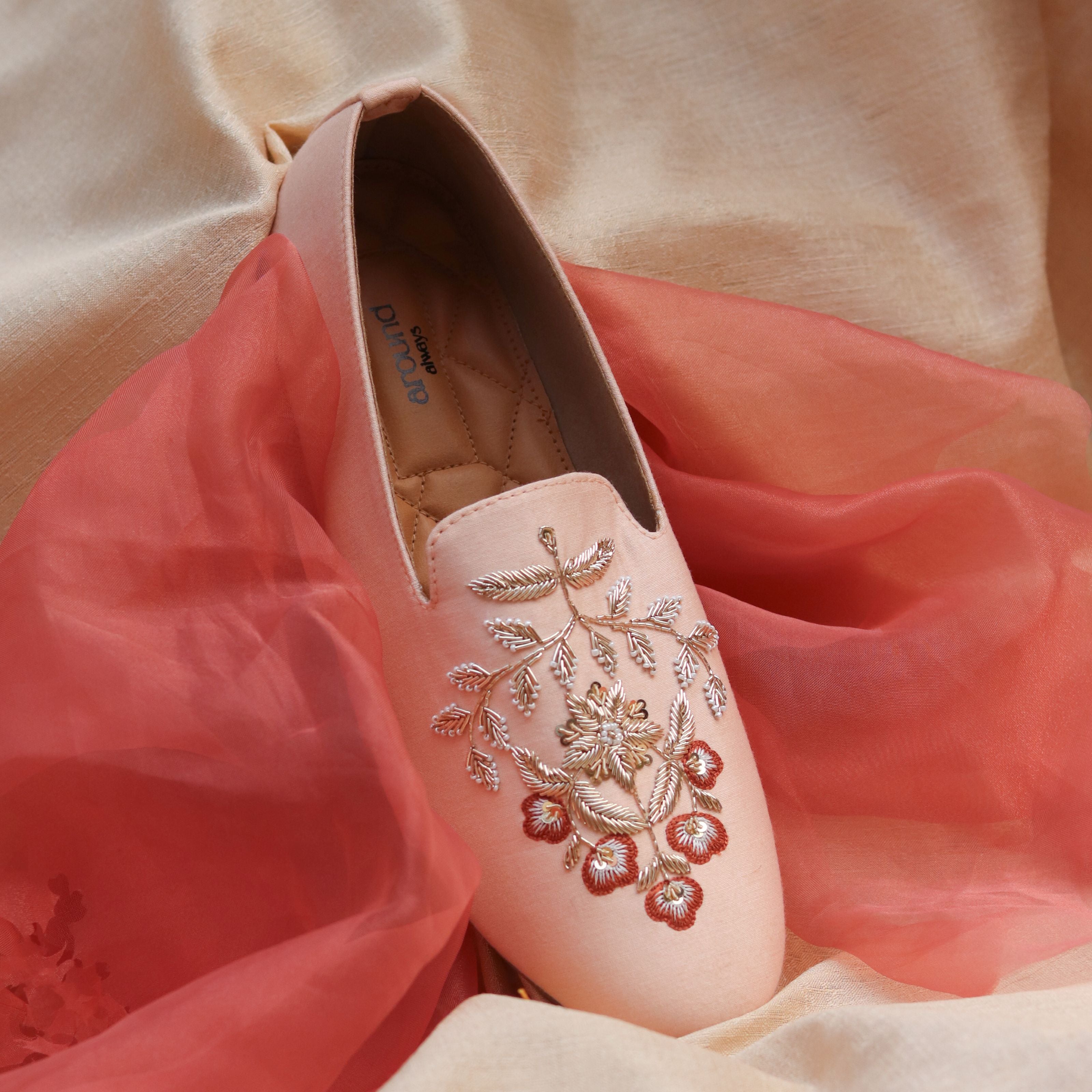 Men’s festive shoes with subtle floral patterns in rich gold and wine, ideal for weddings.