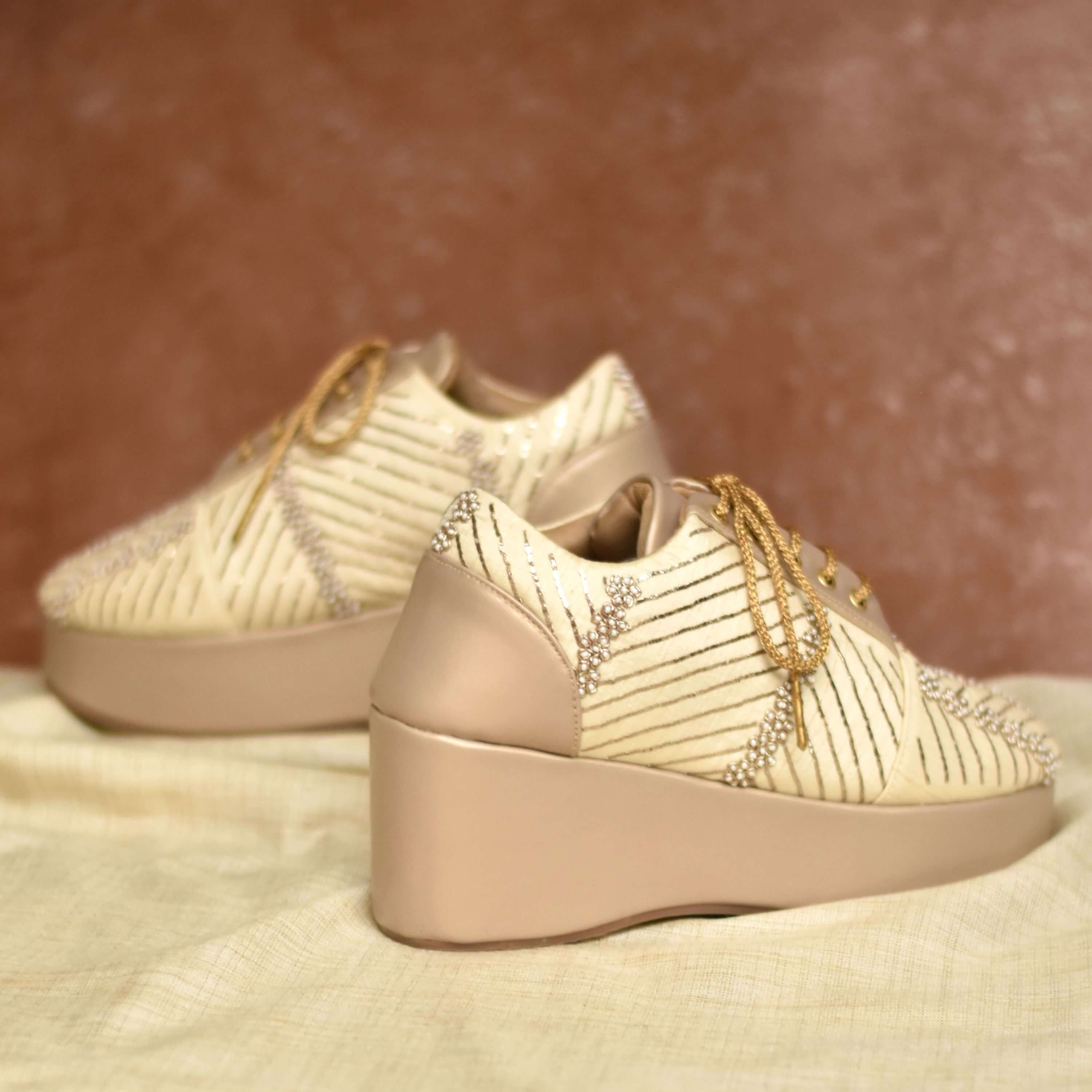 Soft gold wedding heels with beaded design and comfortable platform lift