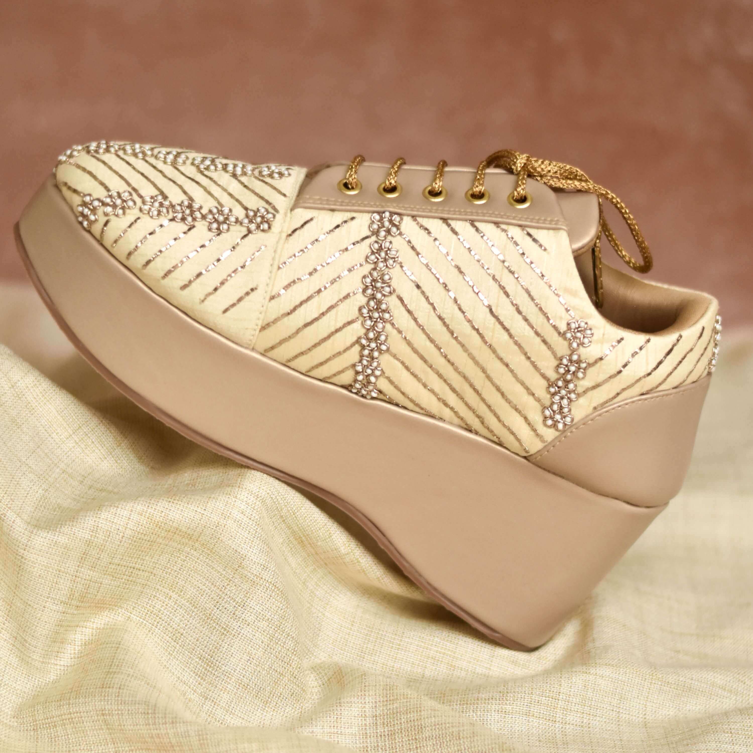 Nude sole heels with golden base and shimmery bead highlights for festive wear