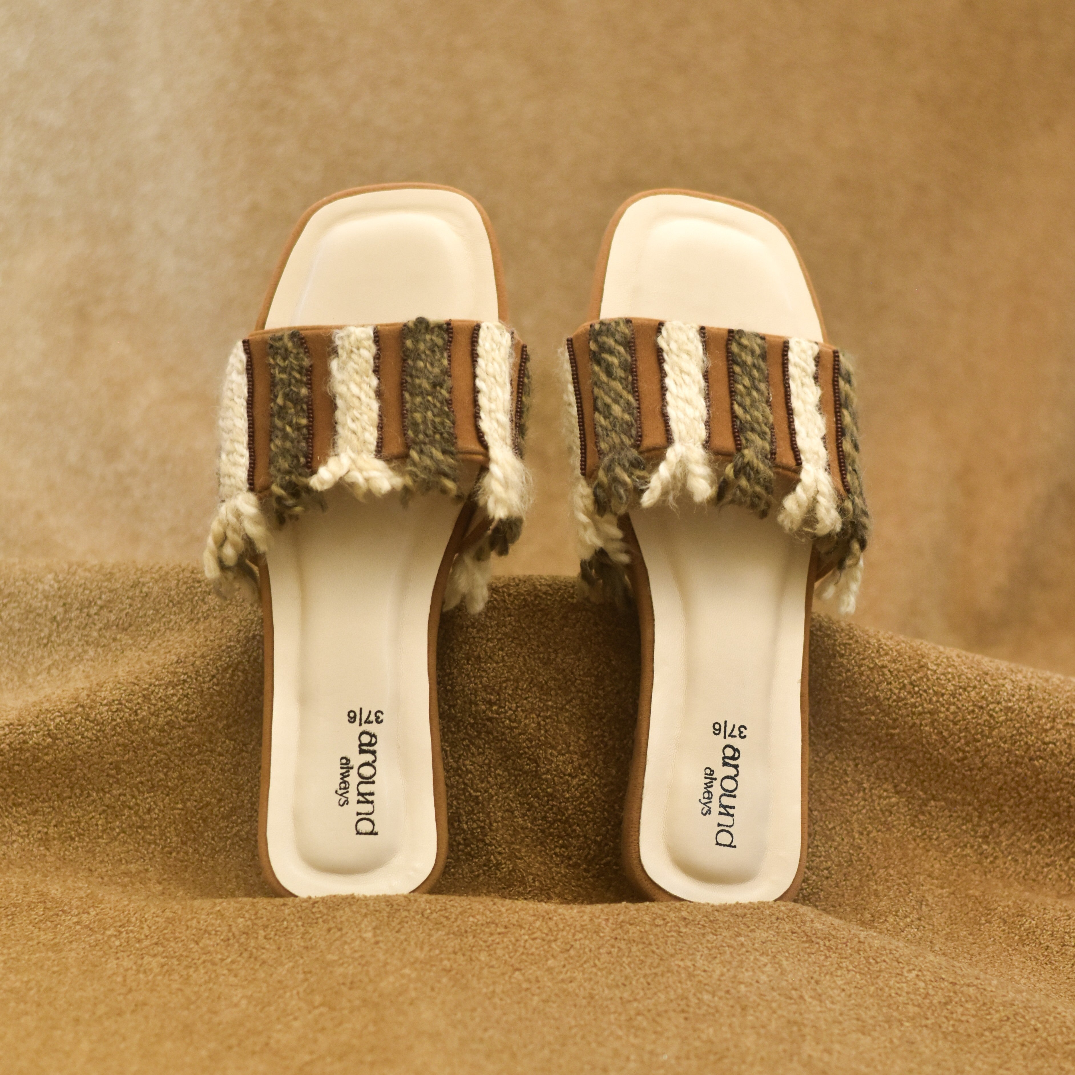 Pair of sandals with woven straps in slip-on pattern and block heel