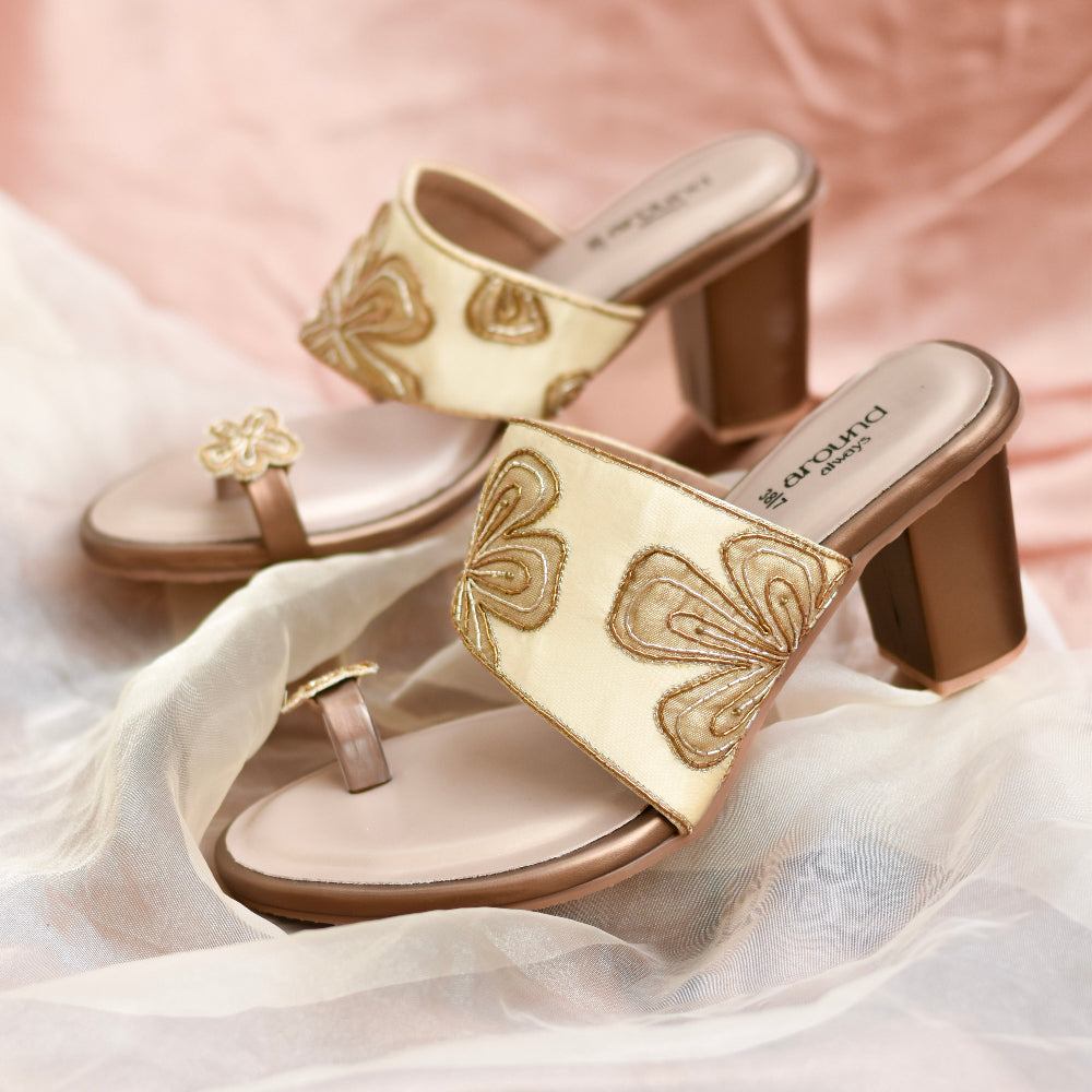 Block heel slip-on with golden strap detailing and 3D motif on thumb grip