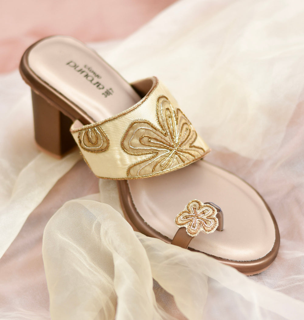 Festive gold and beige heel with hand-crafted pattern and cushioned insole