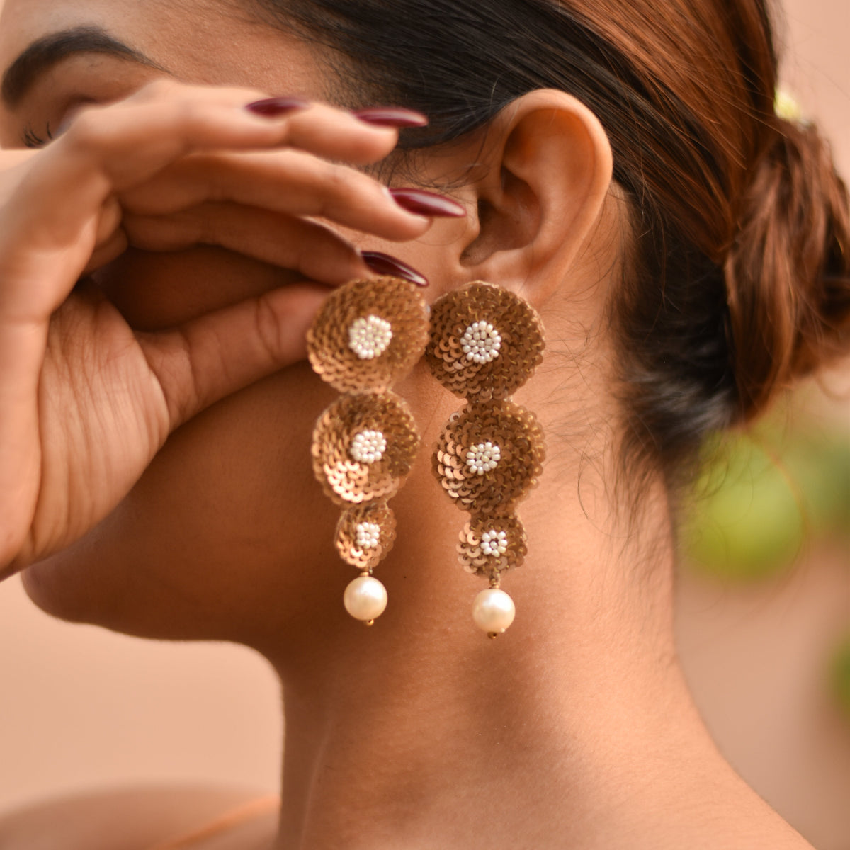 Gold sequin earrings with pearl drop detailing