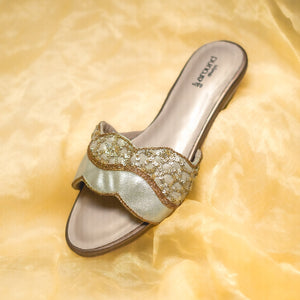 Golden flats with cushioned insole and low heel
