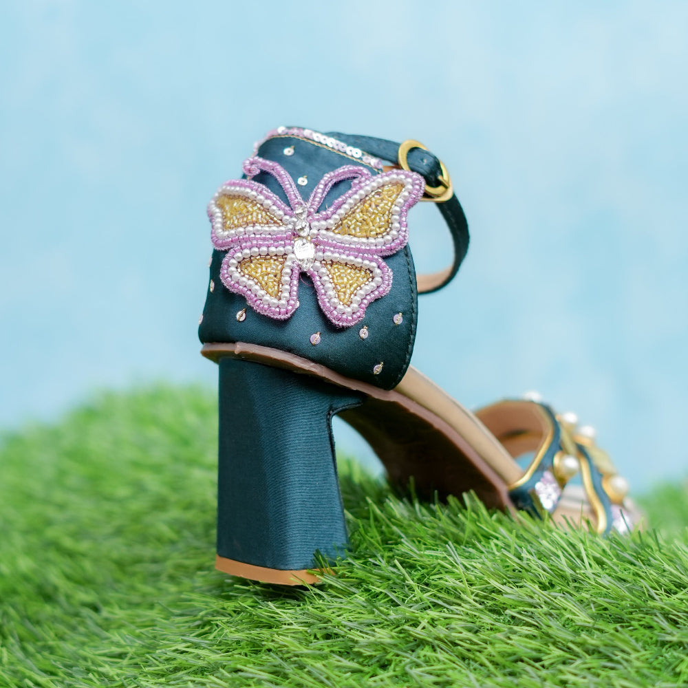 Decorative heels with butterfly design for mehndi occasion.