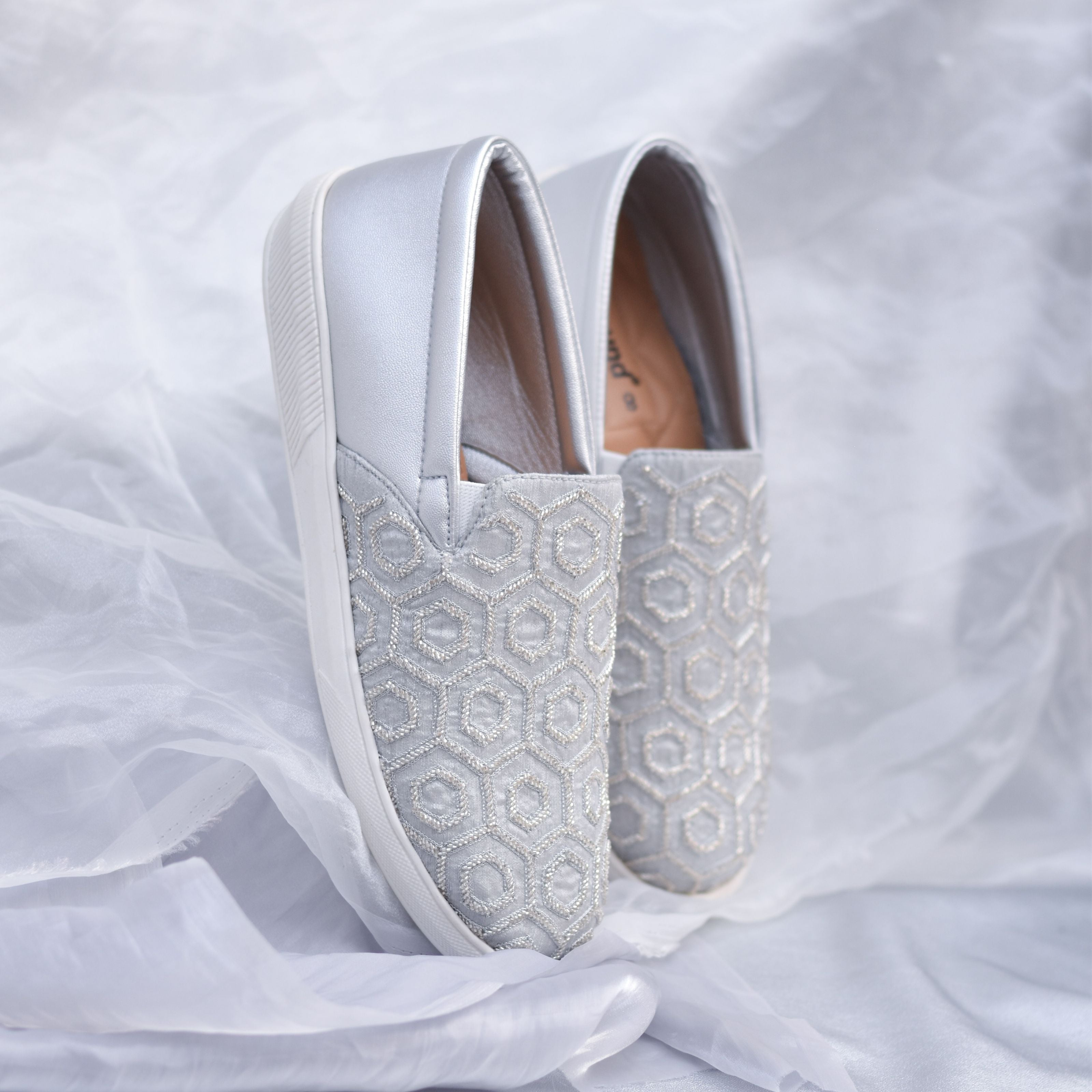 Silver men's slip-on wedding sneakers with geometric beadwork on textured base.