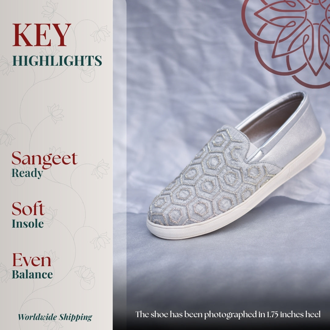 Silver slip ons with geometric embroidered pattern