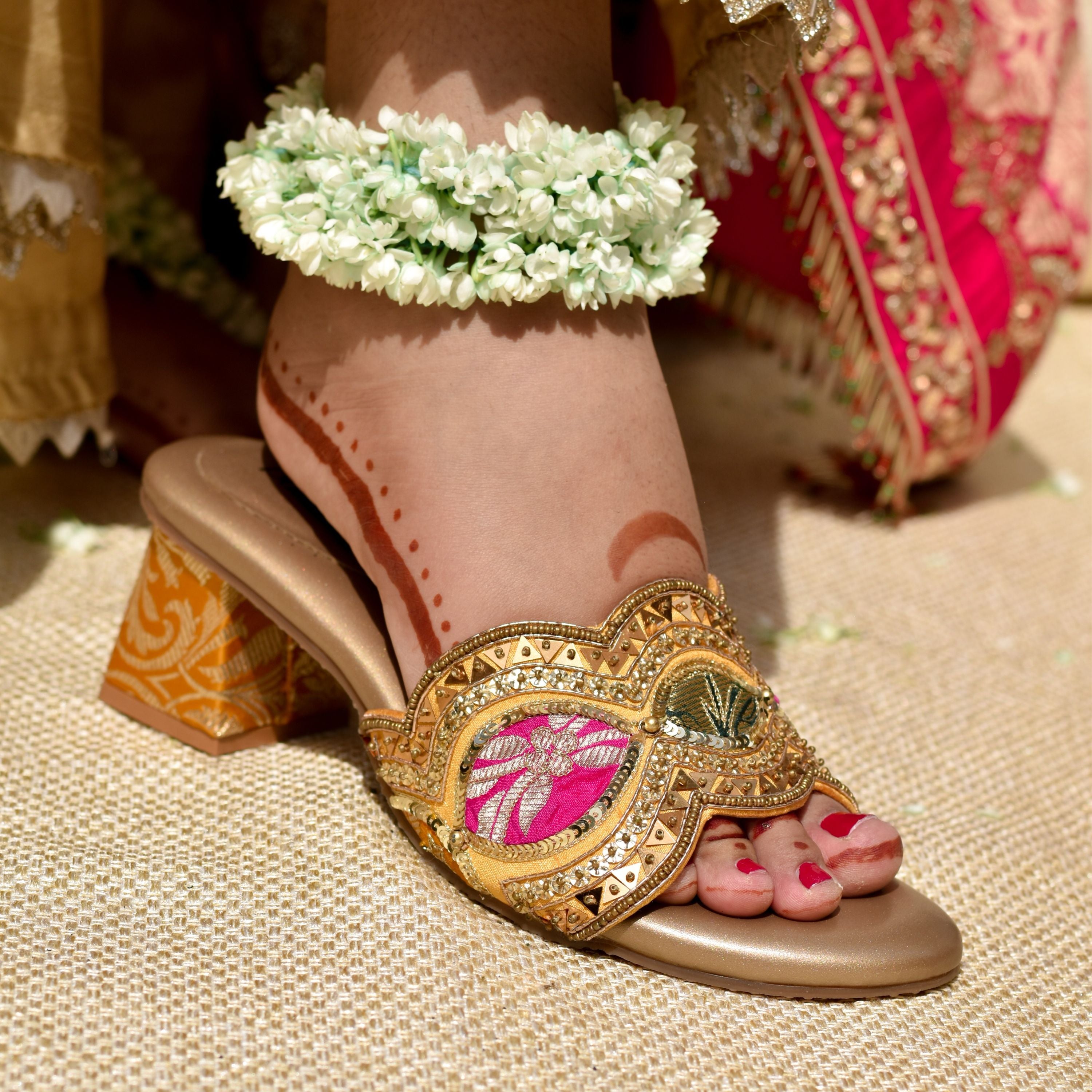 Women’s ethnic slip-on sandals with gold detailing and pink brocade