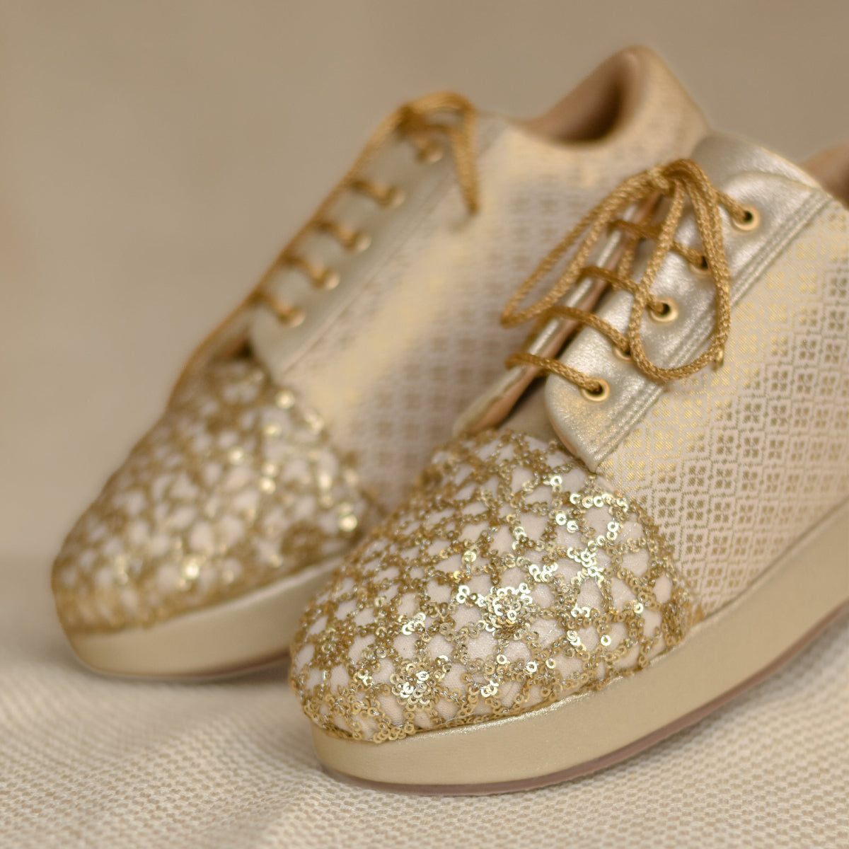Golden sneakers with heels for a classic Indian saree look in a silk saree