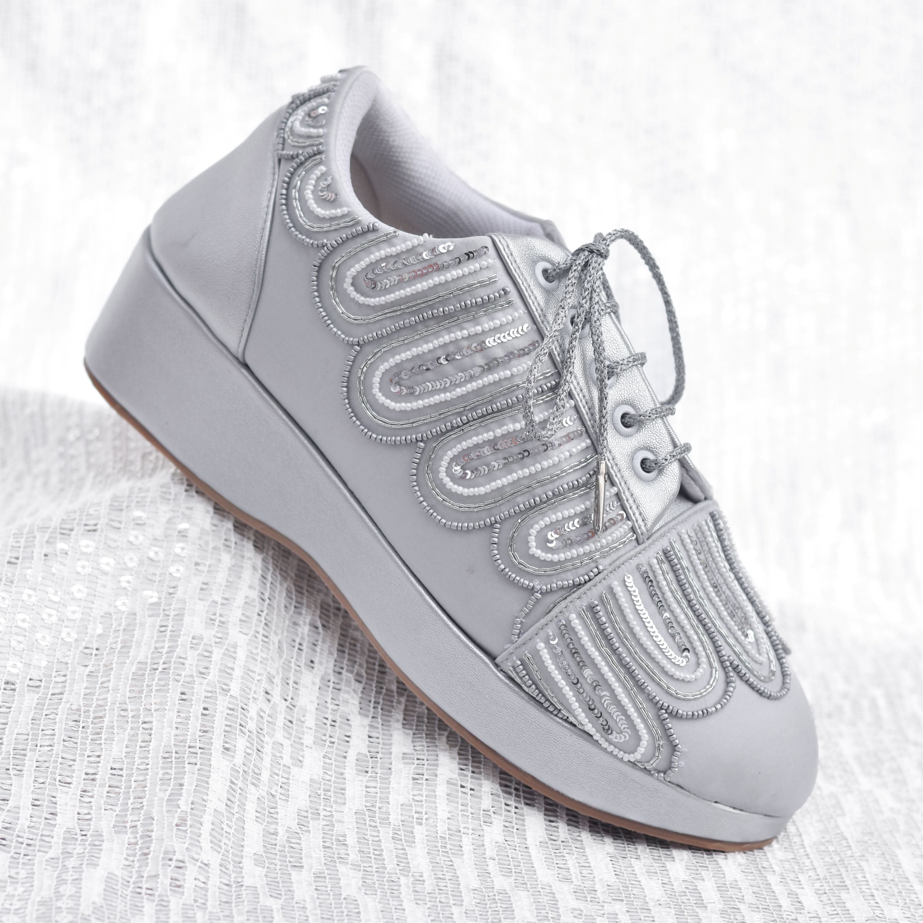 Metallic silver platform sneakers for wedding functions.