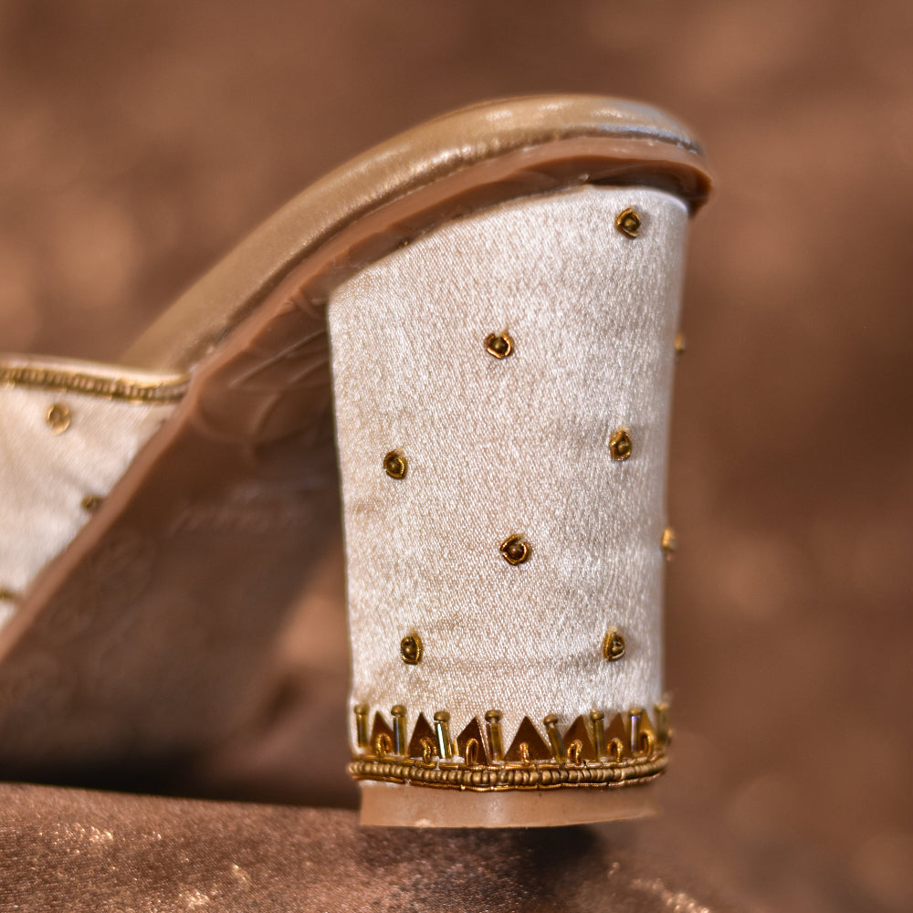 Close-up of a high-heeled shoe minimal embroidery details