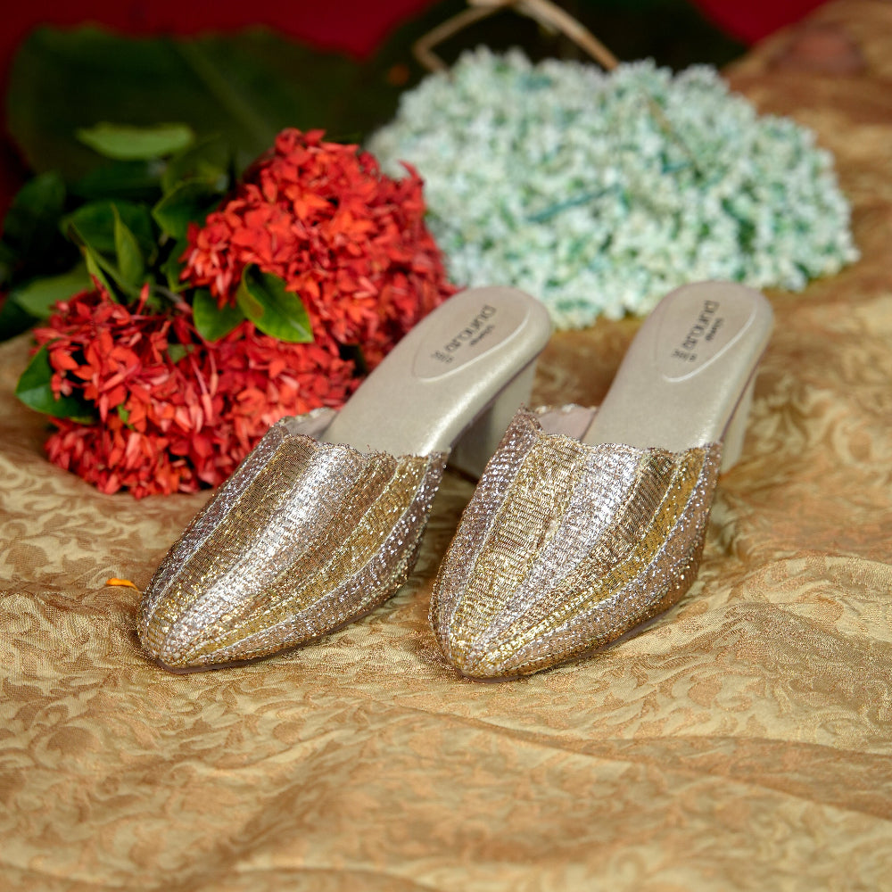 Gold and silver striped mule with pointed front design
