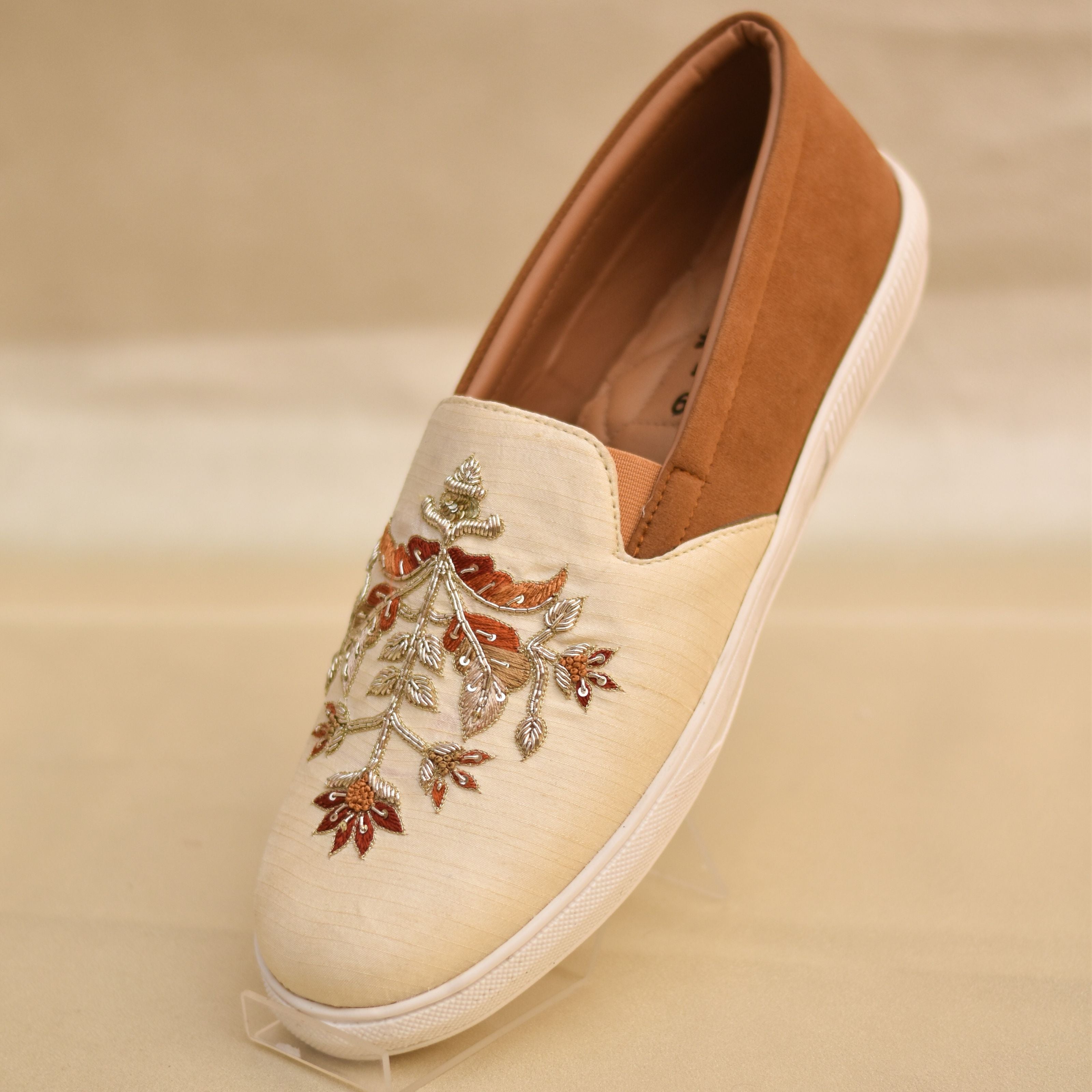 Stylish occasion wear footwear for men with handcrafted nature-inspired motifs.
