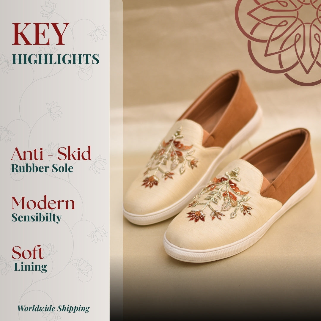 Light toned slip ons  sneakers with handcrafted motifs for all day long