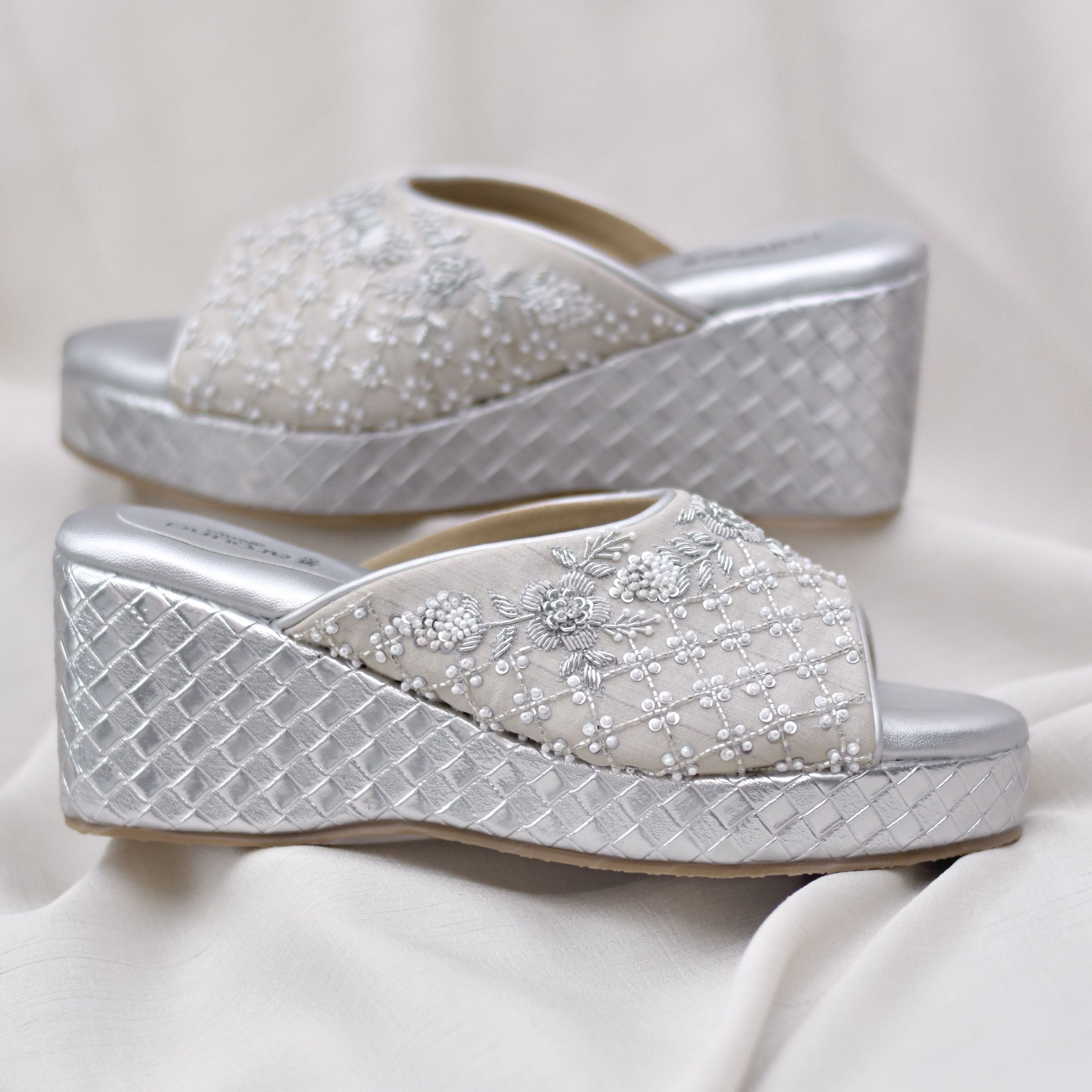Silver wedge footwear with floral beading and pearl details on upper