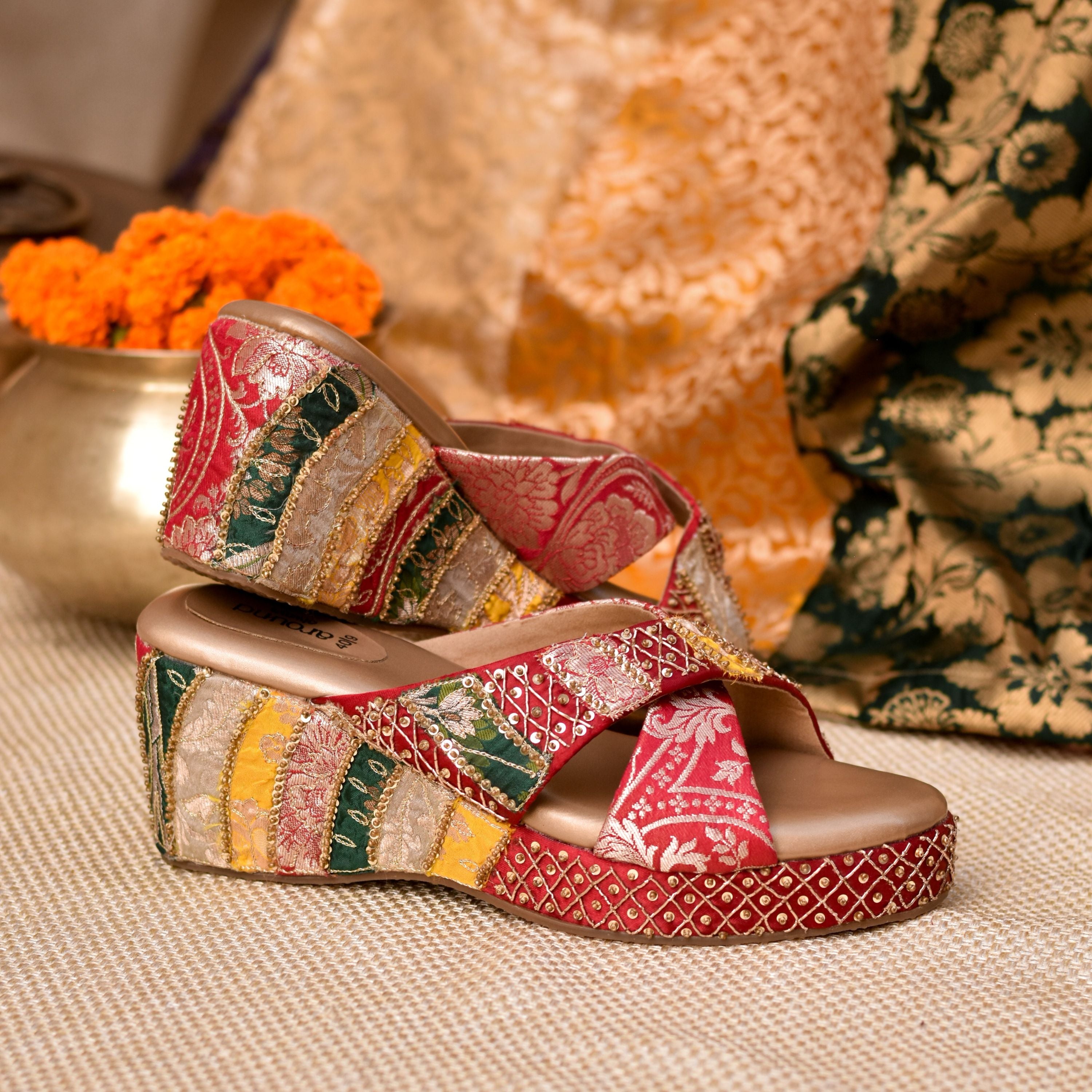 Traditional Indian wedge heels in red, yellow, and green brocade design