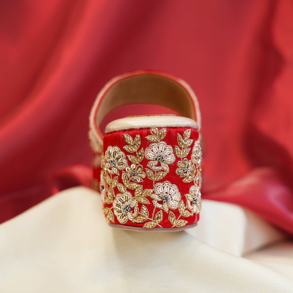 Red and gold embroidered sandals for festive occasions
